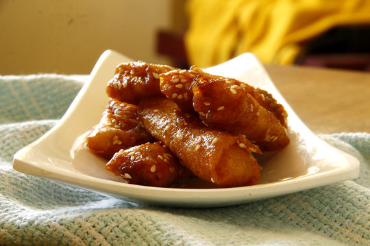 Turon Or Deep Fried Saba Banana In Spring Roll Wrapper With Brown Sugar And Sesame Seeds