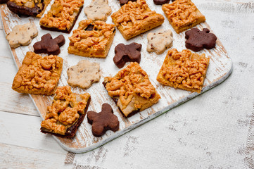 Homemade shortbread cookies lying on a white painted wooden surface. Baking and cooking.