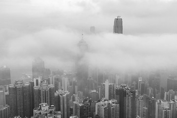 Skyline of Victoria harbor of Hong Kong city in fog