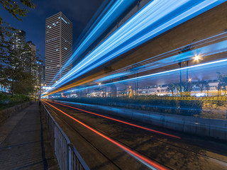 Fototapeta na wymiar light trails of traffic in downtown of Hong Kong city at night. Traffic background
