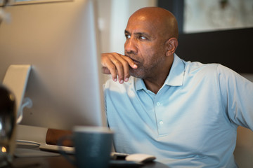 Mature African American man upset and looking concerened.