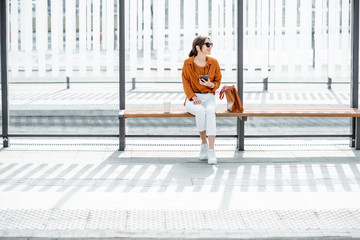 Woman at the public transport stop