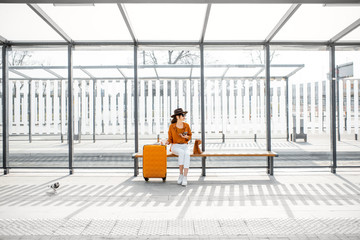 Young traveler at the pulic transport stop