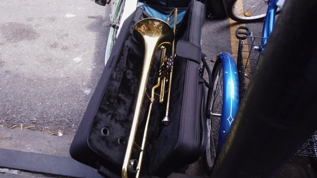 Pull back to reveal a trombone lying in a case, French Quarter, New Orleans, Louisiana.