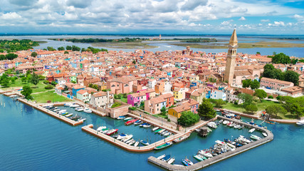 Aerial view of colorful Burano island in Venetian lagoon sea from above, Italy  © Iuliia Sokolovska