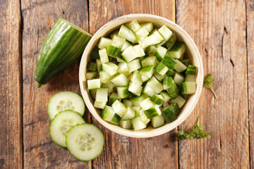 fresh cucumber salad on wood background
