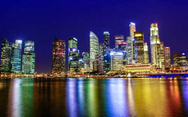 Naklejka na ściany i meble Singapore Downtown City Business District Skyline at Sunset Blue Hour