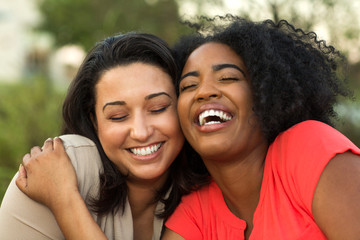 Diverse group of friends talking and laughing.