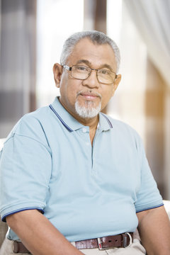 Senior man looking at camera