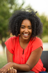 Fototapeta premium Happy confident African American woman smiling outside.