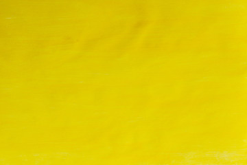 Hand painted gouache on paper in a bright yellow background. Beautiful abstract yellow background texture. Copy space, background, ocher, sand color and beach, needlework background.