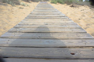 Fototapeta premium boardwalk leading to the beach on the sand