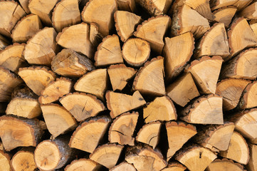 Wall of chopped firewood, Background of dry chopped firewood logs in a pile