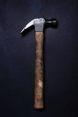 Flat top view photo of an old rusty worn hammer