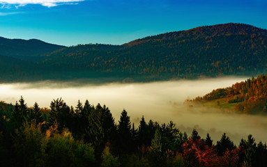 sunrise and fog over the forests and over the hills and the church