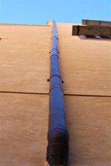 Obraz premium evocative image of a rainwater drain pipe of a period building in the historic center of Palermo in Italy 