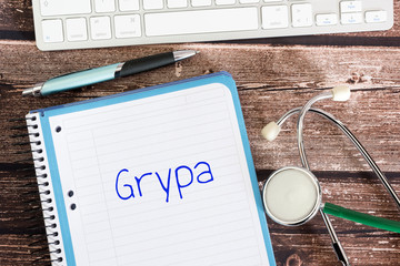 Stethoskop, Arzt und Grippe auf polnisch