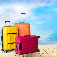 Beautiful colored suitcase on wheels for travel.