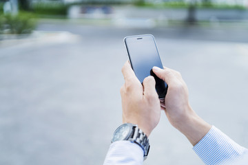Man using mobile phone outdoors