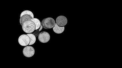 indonesian coins on black background