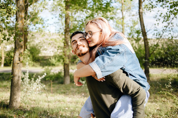 Young smiling couple enjoying in the park.