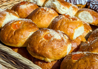 Fresh muffins with jam and sweet powder