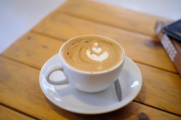 hot latte coffee put on table