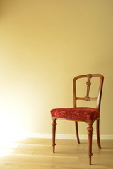 Room of the antique mahogany chair.  window is bright.  This expensive furniture is made in England.  blurred background with copy space.