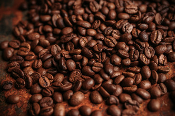 Coffee beans on the rustic background. Selective focus. Shallow depth of field.