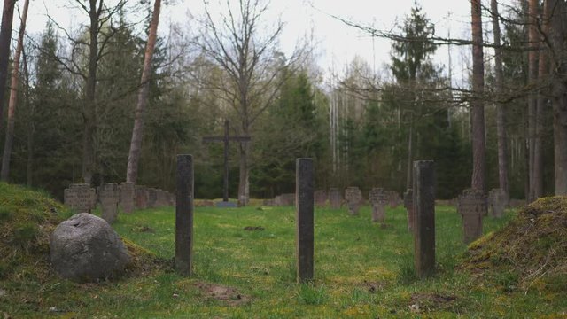 Entrance to an old wartime cemetery in the woods