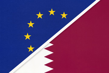 European Union or EU and State of Qatar national flag from textile. Symbol of the Council of Europe association.