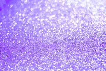 Sparkling bokeh background in a fresh purple color. sequins purple flares background defocus