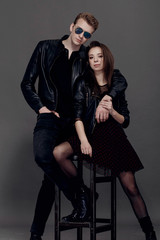cool man and woman on gray background