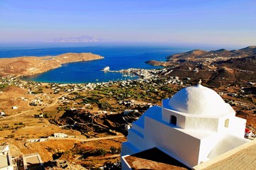 Greece, Serifos island, view of Christian orthodox church with Livadi, the port of Serifos island in the background.