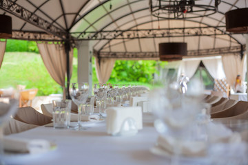 table setting. table setting for the holiday. birthday celebrations. dishes on the table in a restaurant. glasses on the table. wedding party.