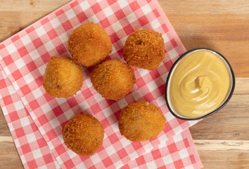 Dutch traditional snack bitterbal on a serving board