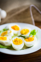 boiled eggs with salad leaves in a plate