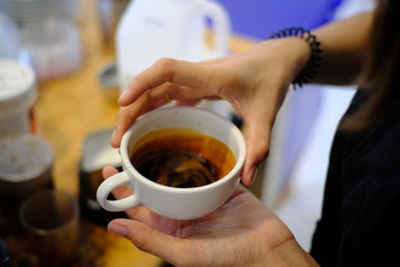 Barista making a cup of coffee latte art.