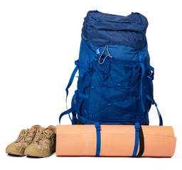 Blue hiking backpack with fitness mat isolated on white background