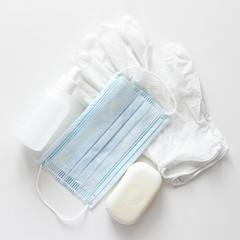 hygiene kit white medical gloves white blue mask white soap and sanitizer on a white background