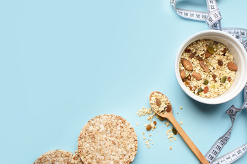 Useful breakfast, proper nutrition, oatmeal, dried fruits, breads, fruits, a centimeter on a light background. Diet. A place for text.