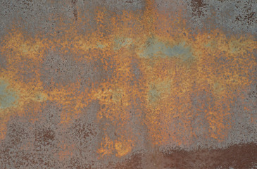 the rusted surface of painted metal garage door