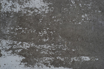 remnants of paint on the scrubbed weathered wall