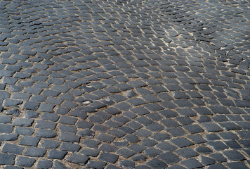 Old vintage black cobblestone street road background texture