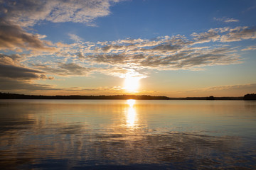 Amazing view of the sunset, lake and sky, gorgeous sky and reflection in the water