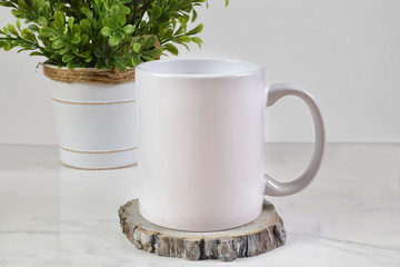 11 ounce Coffee Cup Mockup with Plant