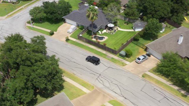 Following a car along a residential street, Bryan, Texas, USA
