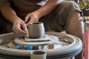 Closeup of sculptor man hand with him job