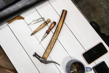 Shoe workshop. Shoe repair and tailoring Photography illustrates a small business. Close up.