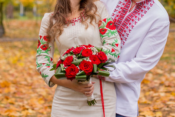 man with woman in folk clothes in autumn